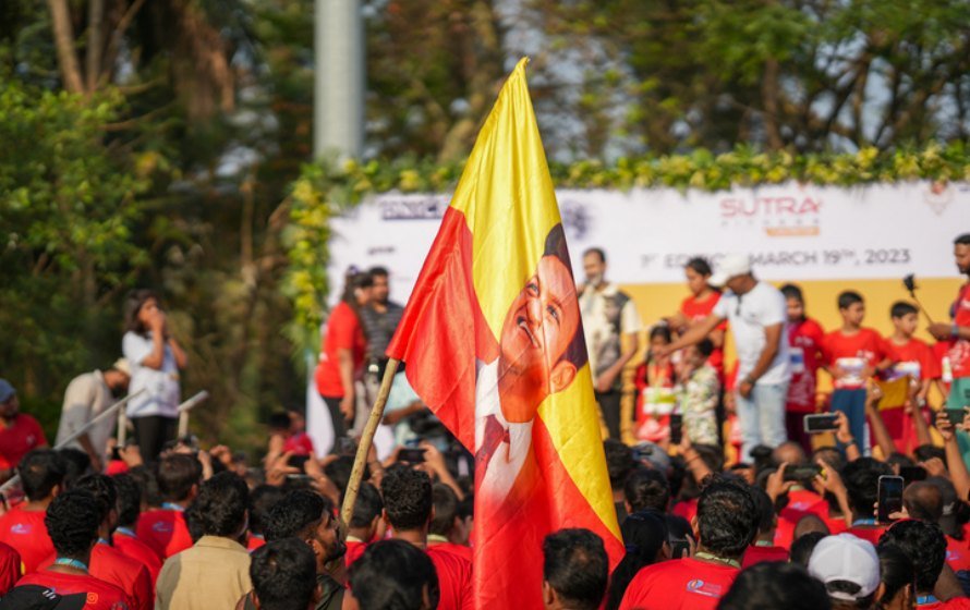 The Karnataka flag raised over the Namma Power Run crowd